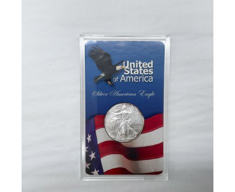 The obverse side features full length of Liberty in stride. She is shown wrapped in the folds of the flag of the United State