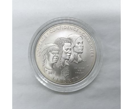 West Point Mint. A commemorative issued coin. The obverse side depicts three girls of different ages to represent the diversi