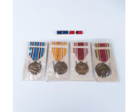 Includes four U.S. Army WWII medals with their ribbon bars: Efficiency Honor Fidelity Medal awarded for Good Conduct, America