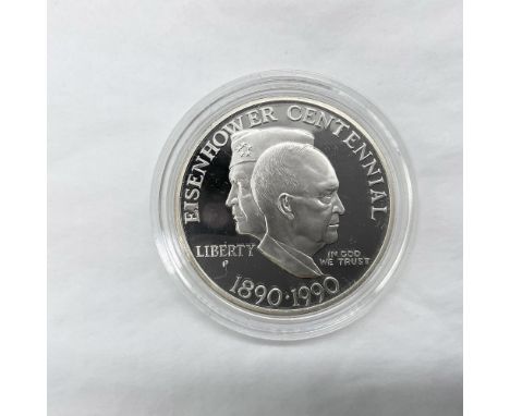 Philadelphia Mint. A Commemorative issued coin. The obverse side depicts two profiles of Eisenhower; one facing left as Five 