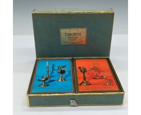 Two decks included in the custom box. Each card has a cel-u-tone finish and is designed with period lamps as seen in the Cinc