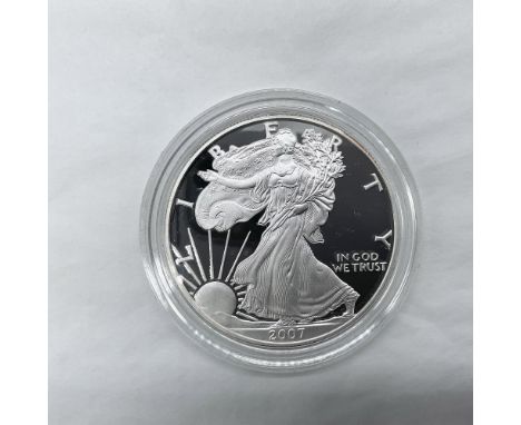 West Point Mint. The obverse side features full length of Liberty in stride. She is shown wrapped in the folds of the flag of