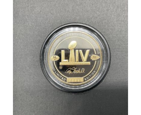A collectible National Football League coin celebrating Super Bowl LIV; San Francisco 49ers verses the Kansas City Chiefs. Fi