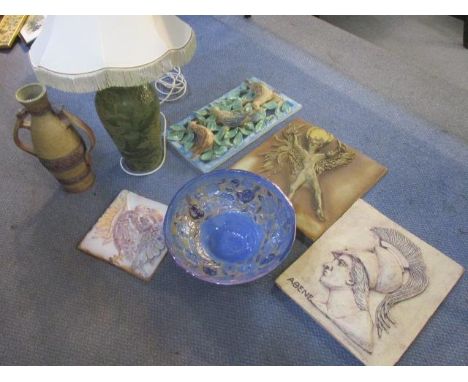 Mixed pottery to include wall plaques, a bowl, a twin handled vase and a table lamp 