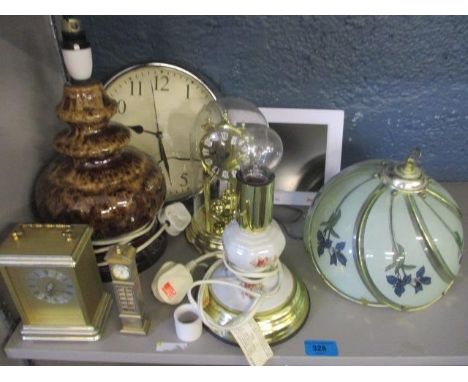 An anniversary clock and three others, together with a retro German pottery lamp and another, as well as a modern electric ph