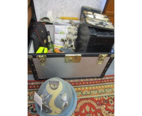 A miscellaneous lot to include a small trunk, comical treen doorstops, clothing, vintage cards and a J &amp; G Morten novelty