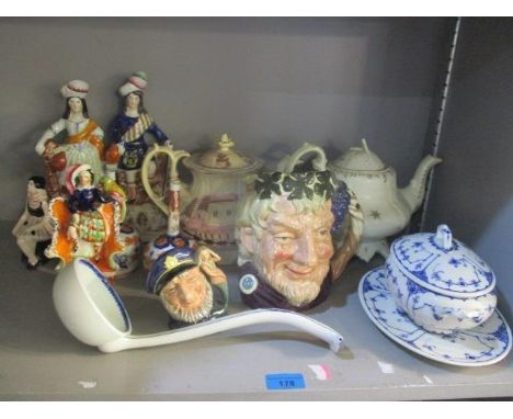 A mixed lot to include Staffordshire flatback figures, Wedgwood ladle, Doulton character jugs and other items 