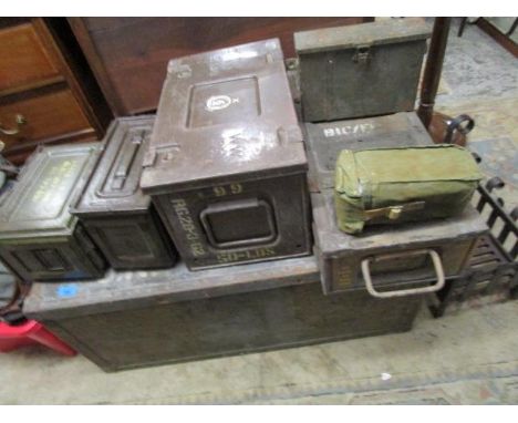 An early 20th century tin travelling trunk and a selection of metal shell and ammunition cases 