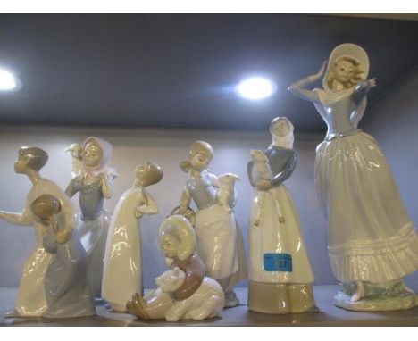 Seven Lladro and Nao figures 