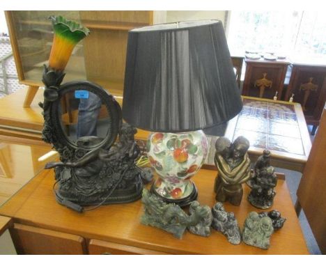 A mixed lot to include a table lamp with inset mirror decorated with a nude woman, Eskimo ornaments and other items 