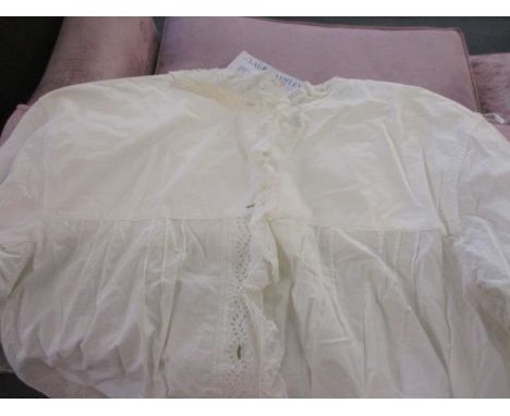 A collection of early 20th century white cotton clothing to include a night gown, two aprons, a scarf and an underskirt, toge