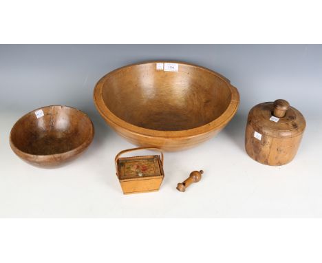 A 19th century turned sycamore dairy bowl, diameter 35cm, a smaller similar food bowl, a large sycamore butter stamp, height 