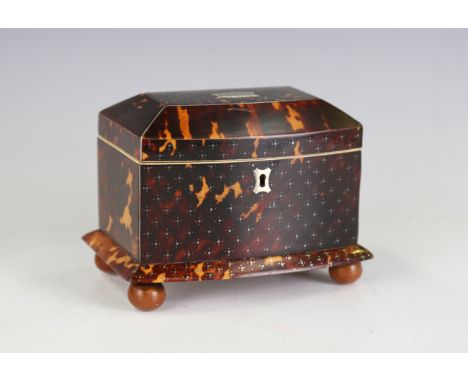 A Regency tortoiseshell bowfront tea caddy with piqué inlaid decoration, the hinged lid opening to reveal twin lidded compart