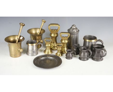 A graduated set of four Victorian brass bell weights, height of tallest 18.5cm, two 19th century brass pestle and mortars, a 