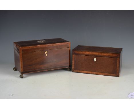 A George III mahogany and inlaid tea caddy with twin interior canisters, raised on brass claw and ball feet, width 30.5cm, to