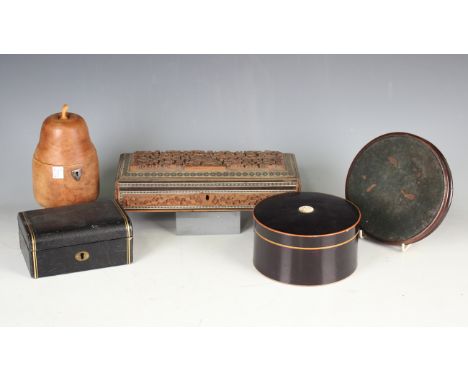 A 20th century fruitwood tea caddy in the form of a pear, height 16.5cm, an ebonized and inlaid collar box, a gilt-tooled bla