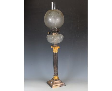 A late Victorian plated and gilt oil lamp of Corinthian column form with hobnail cut clear glass reservoir, Hinks burner and 