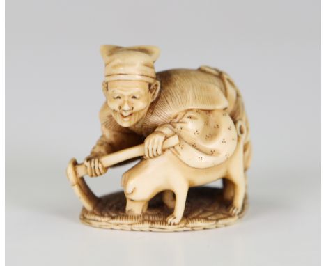 A Japanese carved ivory okimono netsuke, Meiji period, modelled as a farmer and his dog, incised signature to base, height 3.