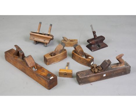 A collection of woodworking planes, including a Maples &amp; Sons beechwood sash plane, two further planes, one detailed 'SOR