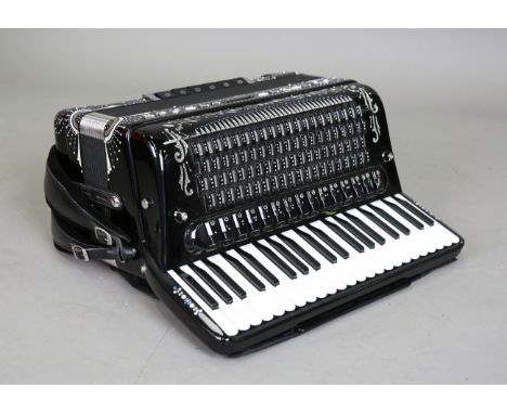 A late 20th century Bugari Armando piano accordion, serial number '427-80', the black case with inset diamanté, cased, togeth