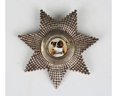 A Victorian silver brooch badge of starburst form, the centre later mounted with an enamelled portrait of a dog, London 1854,