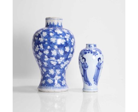 Two Chinese blue and white vases, Kangxi (1662-1722), of baluster form, comprising:one painted with a blossoming prunus tree 