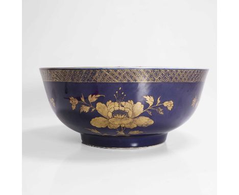 A Chinese export punchbowl, Kangxi (1662-1722), the rounded sides rising from a circular foot, painted with sprigs of peony i