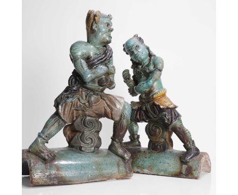 A pair of Chinese turquoise-glazed earthenware ridge tiles, Ming dynasty (1368-1644), each modelled in the form of a striding