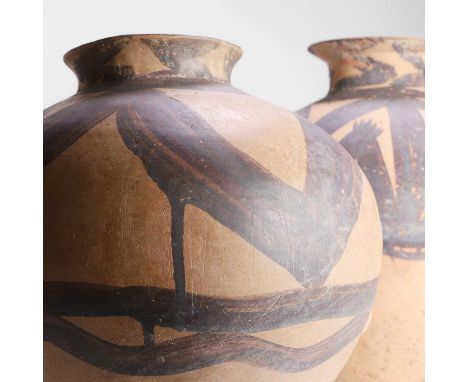 Two Chinese pottery jars, Neolithic period (c.6500-1700 BCE), each with an olive-shaped body with a wide everted neck and a f