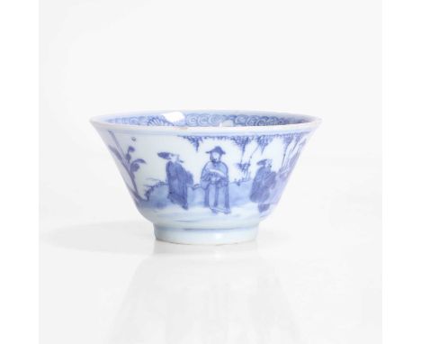 A Chinese blue and white tea bowl, Kangxi (1662-1722), the rounded sides rising from a circular foot to a flared rim, painted
