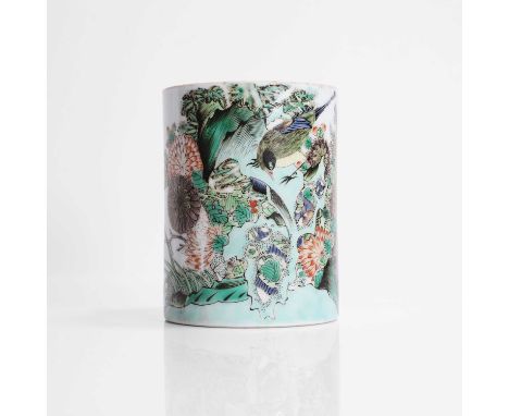 A Chinese famille verte brush pot, Kangxi (1662-1722), of cylindrical form, painted with a bird perched on rocks by chrysanth