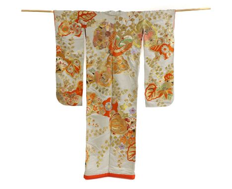 A Japanese uchikake, 19th-20th century, the outer kimono with long furisode (swinging sleeves), embroidered with birds and fl