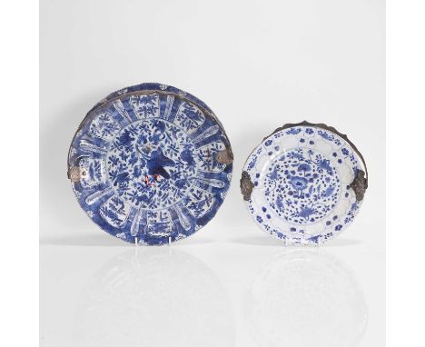 Two Chinese blue and white plates, Kangxi (1662-1722), each of lobed circular form, painted with sprigs of flowers, the rim m