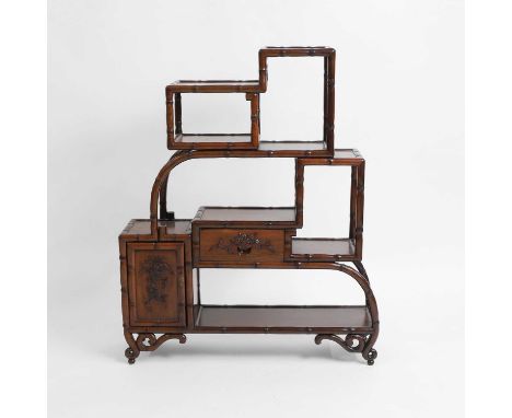 A Chinese display cabinet, 20th century, with a configuration of open shelves bordered by simulated bamboo, with a drawer and