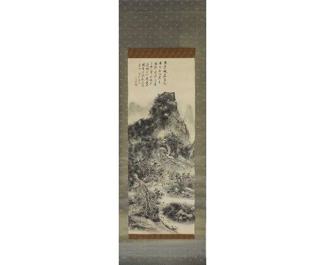 A Chinese hanging scroll, 20th century, in the style of Huang Binhong (1865-1955), painted with a literatus walking across a 
