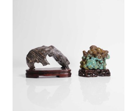 Two Chinese scholar's rocks, 20th century, comprising one turquoise boulder, and the other of blackish-grey tone with narrow 