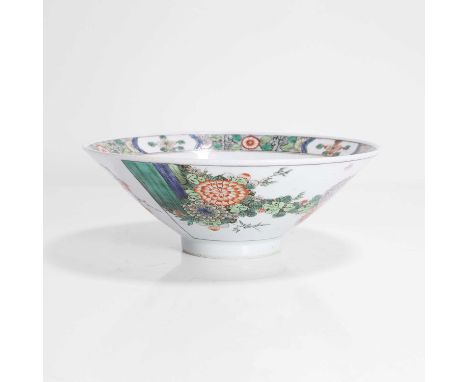 A Chinese famille verte bowl, Kangxi (1662-1722), of conical form, painted with peony and chrysanthemum in two fan-shaped pan