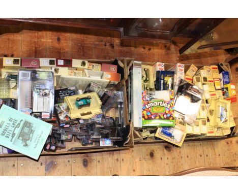 Two boxes of model vehicles