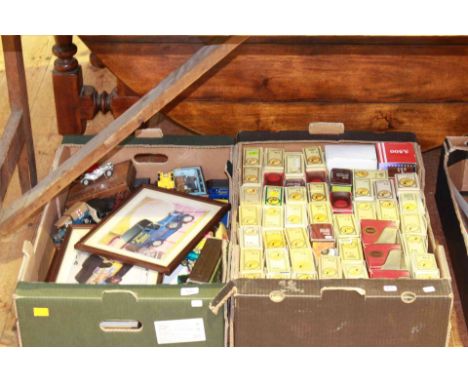 Two boxes of model vehicles and pictures