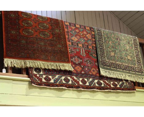 Persian design carpet with a red ground 2.80 x 1.65 and two rugs (3)