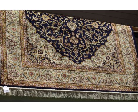 Keshan carpet with a blue ground 2.30 x 1.60