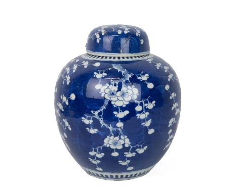 A LARGE CHINESE BLUE AND WHITE GINGER JAR WITH COVER, QING DYNASTY  White flowering plum tree on deep blue ground, base mark 