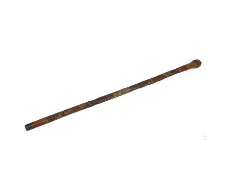 A JAPANESE CARVED BAMBOO WALKING STICK, MEIJI PERIOD  Low relief carving depicting Samurai in action, length 91cm.