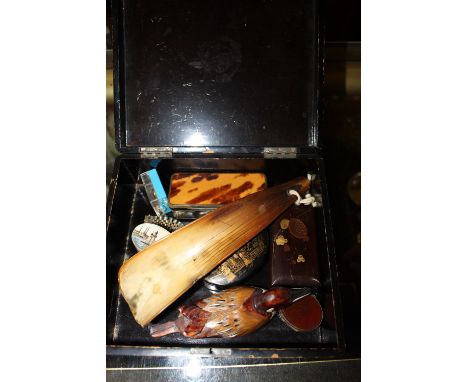 A Japanese lacquered box and contents to include a Victorian horn snuff box; a 19th Century agate set pill box; a papier mach