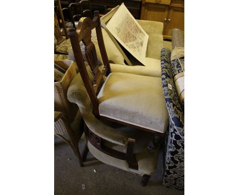 An Edwardian walnut nursing chair; an Edwardian button back tub chair