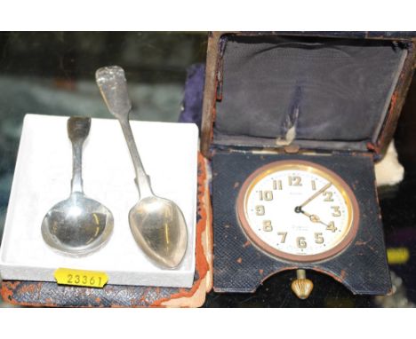 A William IV silver caddy spoon, London 1834 together with a 19th Century silver teaspoon and a leather cased travelling eigh