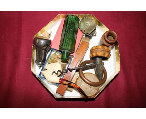 A tray containing a Meerschaum pipe in the form of a lion's head; four Wade Whimsies; a folding wooden rule; a brass and wood