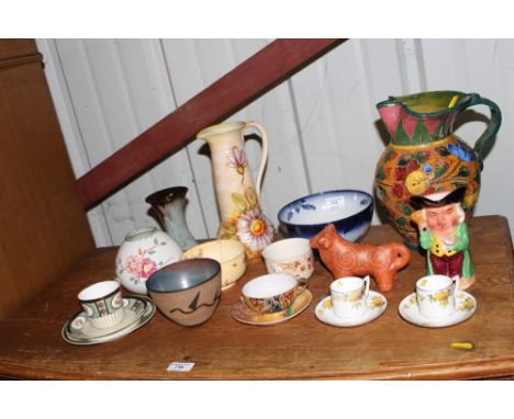 A Royal Art pottery jug; an Italian pottery jug; two Royal Doulton coffee cups and saucers; a studio pottery bowl with mark t