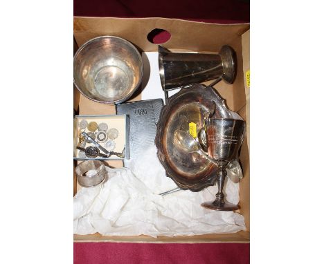 A box of silver and plate to include a George III caddy spoon; a modern silver tea spoon; a serviette ring; goblets etc.