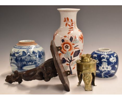 Two Chinese blue and white ginger jars, one decorated with prunus blossom, carved hardwood figural wall bracket, brass table 